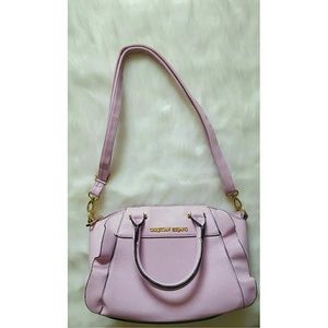 Pink Christian Siriano handbag.